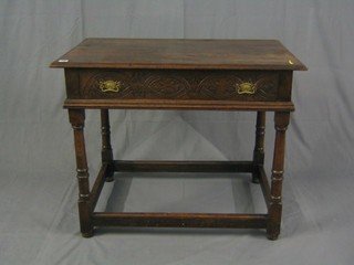 A Victorian carved oak side table, fitted a frieze drawer and raised on turned and block supports 37"