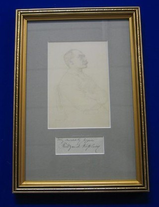 A print of a seated Rudyard Kipling together with a slip of paper signed Sincerely Rudyard Kipling