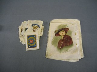 A collection of various Kensitas silk cigarette cards, flags, military badges etc