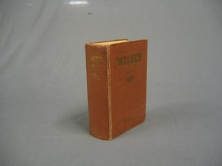 A 1950 edition of Wisden, card covered
