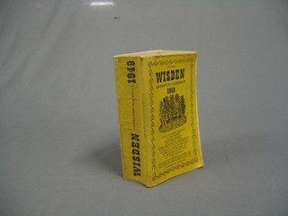 A 1950 edition of Wisden, paper covered