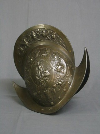 A well made 16th Century style bronzed cast iron Morion helmet decorated classical figures in relief