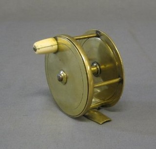 A 19th Century brass fishing reel with ivory handle by Charles Farlow & Co. 191 The Strand London, 4" 