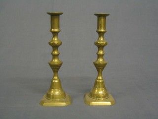A pair of 19th Century brass candlesticks with knopped stems 9"