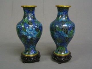 A pair of fine quality 20th Century Chinese blue ground and floral pattern cloisonne vases of baluster form 11", cased