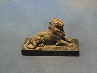 A spelter figure of a seated lion, the base marked Soumme 7"