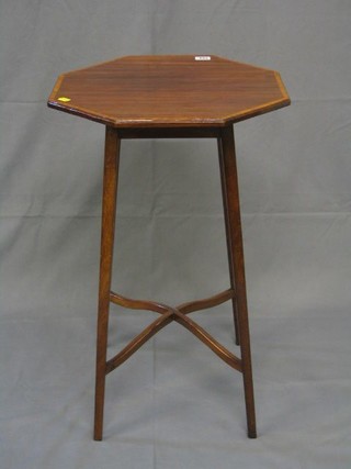 An Edwardian octagonal inlaid mahogany occasional table  raised on square tapering supports with X framed stretcher 18"