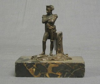 A bronze figure of a standing Napoleon raised on a square veined marble base 3"