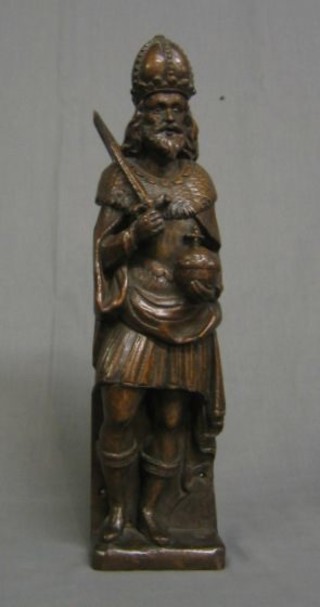 A 19th Century carved oak figure of a Nobleman with mitre, sword and orb 18"