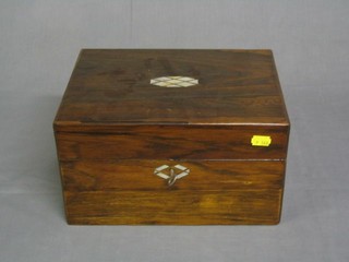 A Victorian rosewood vanity case the lid inlaid mother of pearl, the interior fitted 7 cut glass bottles, 12"