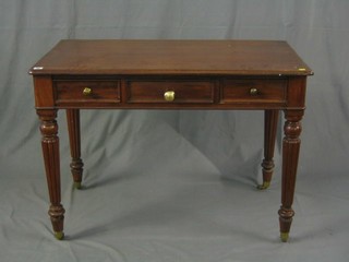 A Victorian mahogany side table fitted 2 drawers and 1 dummy drawer, raised on turned and reeded supports, ending in brass caps and castors 42"