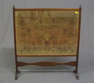 A Georgian wool work sampler with house animals and trees and with motto, by Mary White dated 1804 19" x 26" contained in a mahogany fire screen