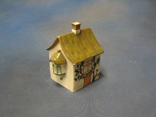 A 19th Century Staffordshire pastel burner in the form of a cottage 3" (f)