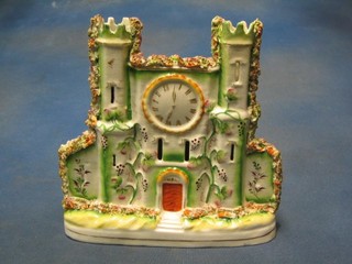 A 19th Century Staffordshire flat back ornament in the form of a castle, the centre set a clock 8 1/2" (f and r)