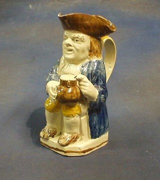 An 18th Century Staffordshire pottery Toby jug in the form of a seated Toby Philpots 9" (f)