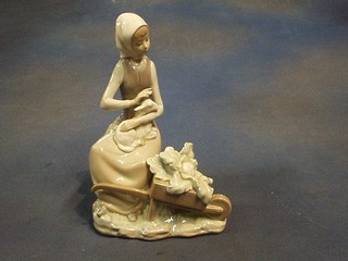 A 1972 Lladro figure Girl with Wheelbarrow, base incised 20 issue no. 01004816, 10"