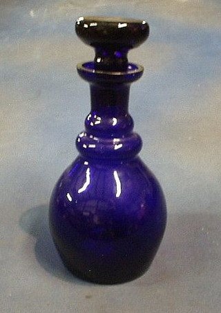 A 19th Century mallet shaped Bristol blue glass decanter and stopper 11"