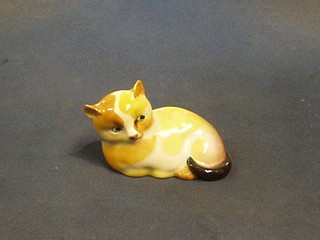 A Royal Doulton figure of a seated cat, the base marked Royal Doulton 5" (crack to base)