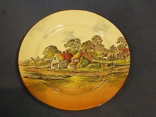 A Royal Doulton seriesware plate decorated a country cottage, the reverse marked Danbuy Royal Doulton and incised 1-30 10"