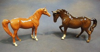 A Beswick figure of an Arab Horse, base marked Beswick 95 (legs f and r) 7" and a figure of standing bay horse (legs f and r) 7" 