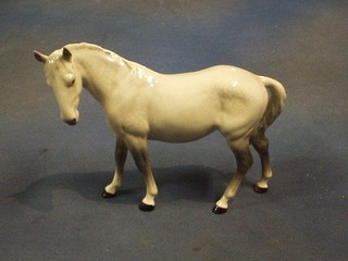 A Beswick figure of a standing dapple grey horse 8"