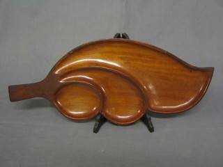 A carved hardwood 3 section nut dish in the form of a leaf