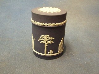 A Wedgwood blue Jasperware cylindrical jar and cover, the base marked Wedgwood 73, 4"
