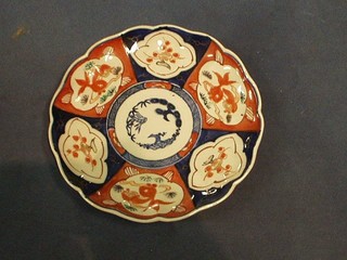 A 19th Century circular Japanese Imari porcelain plate with panel decorated 8"