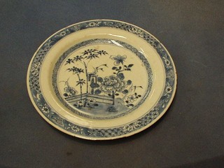 An 18th/19th Century Oriental blue and white porcelain plate decorated fence and flowers 9"