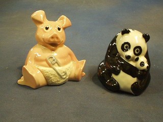 A Wade NatWest piggy bank in the form of baby pig and a NatWest piggy bank in the form of a panda and baby panda
