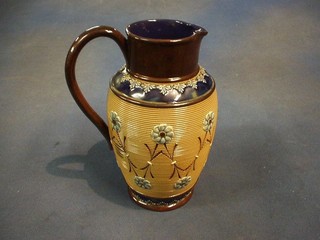 A Royal Doulton Lambeth jug with floral decoration, base marked Doulton Lambeth England 8831 9" (r)