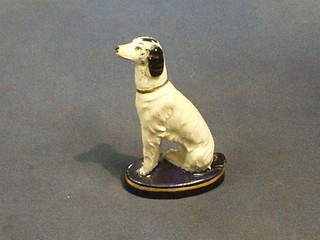 A Staffordshire style figure of a seated dog 5"