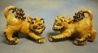 A pair of 19th/20th Century Oriental "terracotta" figures of Dogs of Fo 8"