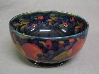 A circular Moorcroft pomegranate patterned bowl the base with signature mark and impressed Moorcroft Y Made in England B, 7"
