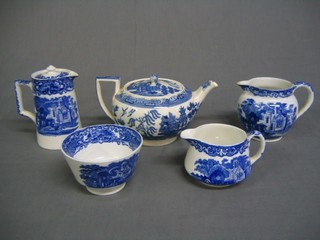A collection of various blue and white table china including cheese dish, teapot, hotwater jug, moulded glass decanter, Meakin dinner ware, a German porcelain pipe bowl and a carved wooden pipe