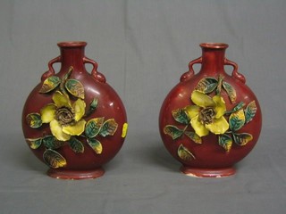 A pair of red glazed pottery moon flasks with floral decoration 10", a German beerstein, 2 Oriental blue and white plates etc