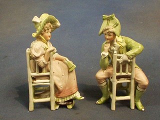 A pair of 19th Century biscuit porcelain figures of a seated lady and gentleman (f and r) 7"