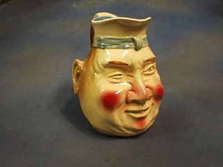 A large pottery character jug 7"