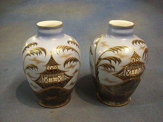 A pair of 1930's blue glazed pottery vases with chinoiserie decoration 8"