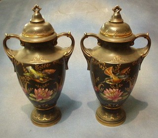 A pair of Edwardian Alton black glazed pottery twin handled vases and covers decorated birds 19" (1 chipped f and r)