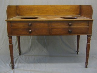A  19th Century mahogany double receptical wash stand with three-quarter gallery, the base fitted 2 long drawers, raised on turned supports 47"