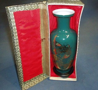 A 20th Century Oriental green glazed club shaped vase with gilt decoration decorated fabulous birds, cased
