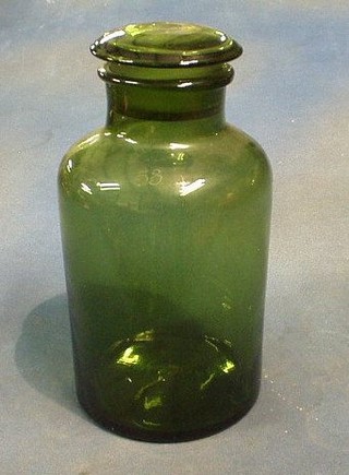 A 19th Century Continental green glass storage jar and cover, 11", the lid marked 50, the base marked 53