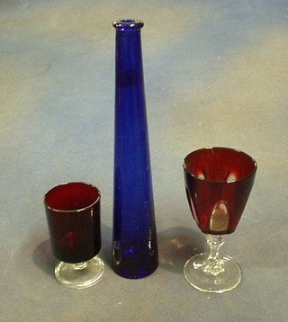 A square blue glass bottle 10", 2 cylindrical blue glass bottles, a set of 6 red and white wine glasses and 3 wine glasses