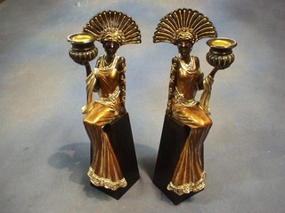 A pair of Art Deco style resin candlesticks in the form of ladies 13"