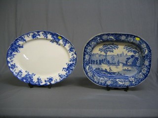 A 19th Century lozenge shaped meat plate decorated a landscape 17 1/2" cracked and a blue and white meat plate 18"
