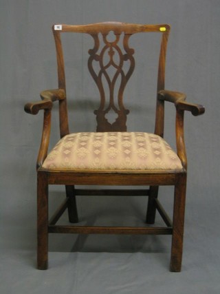 A  19th Century Country oak Chippendale style carver chair with upholstered drop in seat raised on square tapering supports