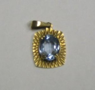 A 9ct gold pendant set a blue stone