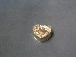 An Edwardian embossed silver heart shaped trinket box with hinged lid 2", Chester 1908