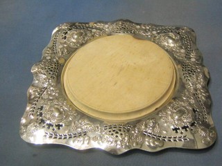 An embossed and pierced silver plated cheese board holder by Walker & Hall